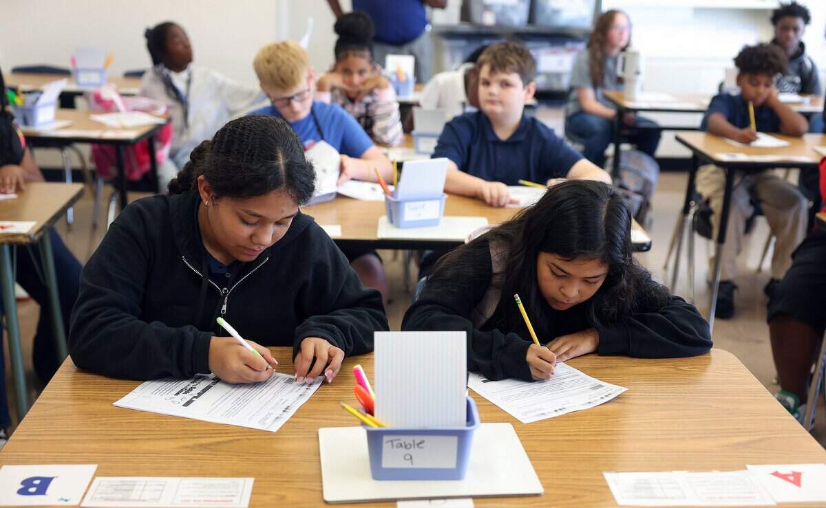Students sit in pairs while during a sixth grade science class at William Monnig Middle School on Friday, Aug. 14, 2026, in Fort Worth. The school is part of the Elevate Network.